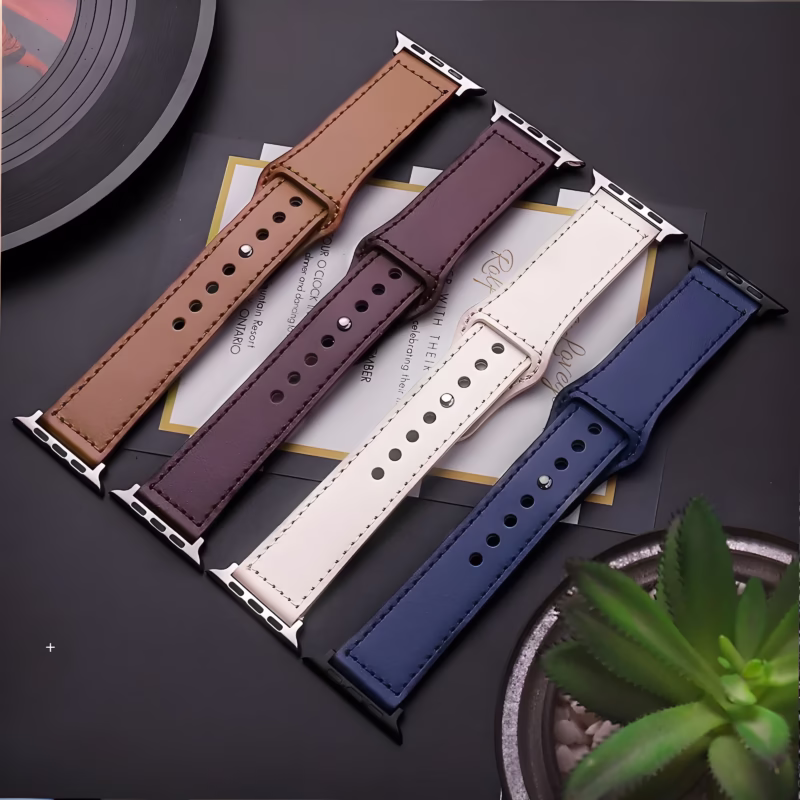 Bracelet Apple Watch EzStrap en cuir lisse avec couture apparente, style élégant, décliné en plusieurs coloris, présenté à plat sur une surface sombre avec quelques éléments décoratifs.