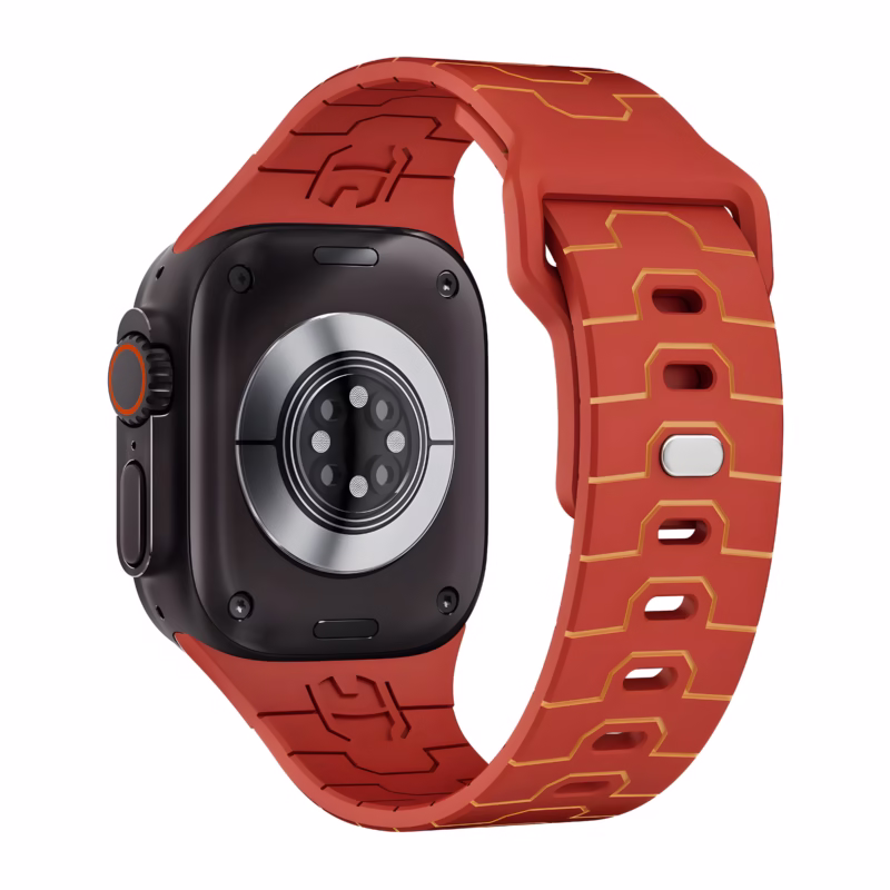 Bracelet Apple Watch EzStrap en silicone rouge au motif armure stylisée, présenté en gros plan sur une montre noire.