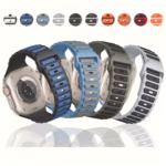 Bracelet Apple Watch EzStrap en silicone perforé, de style sport, décliné en plusieurs coloris, présenté en vue de dos sur des montres posées en alignement sur une surface réfléchissante.