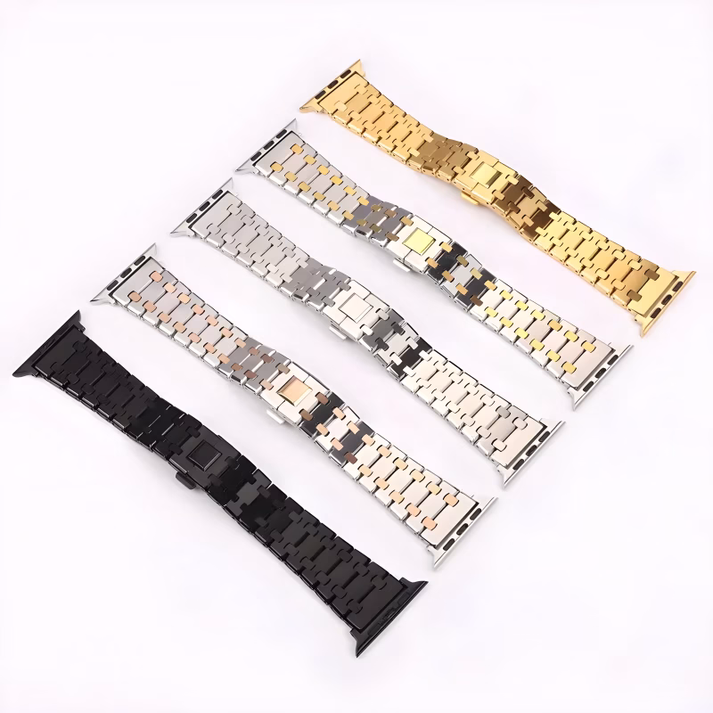 Bracelet Apple Watch EzStrap en métal, finition bicolore à maillons articulés, au style élégant et texture lisse et brossée, présenté à plat sur fond blanc avec plusieurs variantes de couleur alignées.