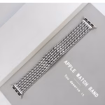 Bracelet Apple Watch EzStrap en métal alliage de zinc, style luxe avec design grain de riz et finition lisse, présenté à plat sur une surface grise près d'une boîte blanche.