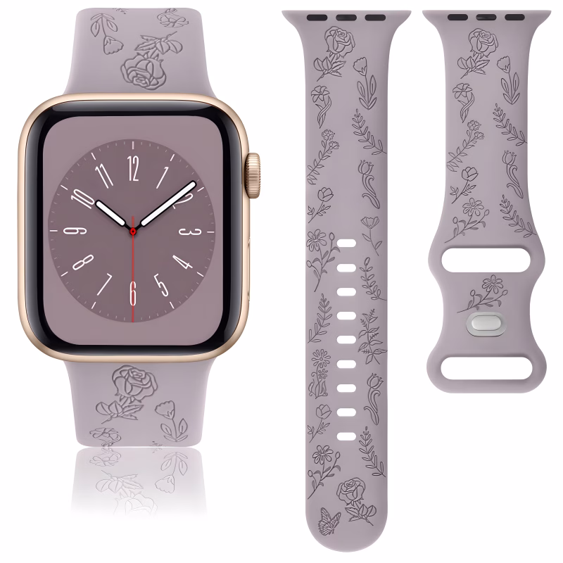 Bracelet Apple Watch EzStrap en silicone élégant violet mat, orné d’un motif floral gravé, présenté en gros plan avec deux vues du bracelet et une montre connectée assemblée.