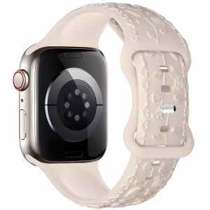 Bracelet Apple Watch EzStrap en silicone texturé de couleur beige, style élégant, avec motif floral en relief 3D, présenté en gros plan sur une montre connectée.