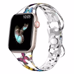 Bracelet Apple Watch EzStrap en silicone transparent, style sport, avec motif imprimé de papillons colorés, présenté en gros plan sur fond blanc.